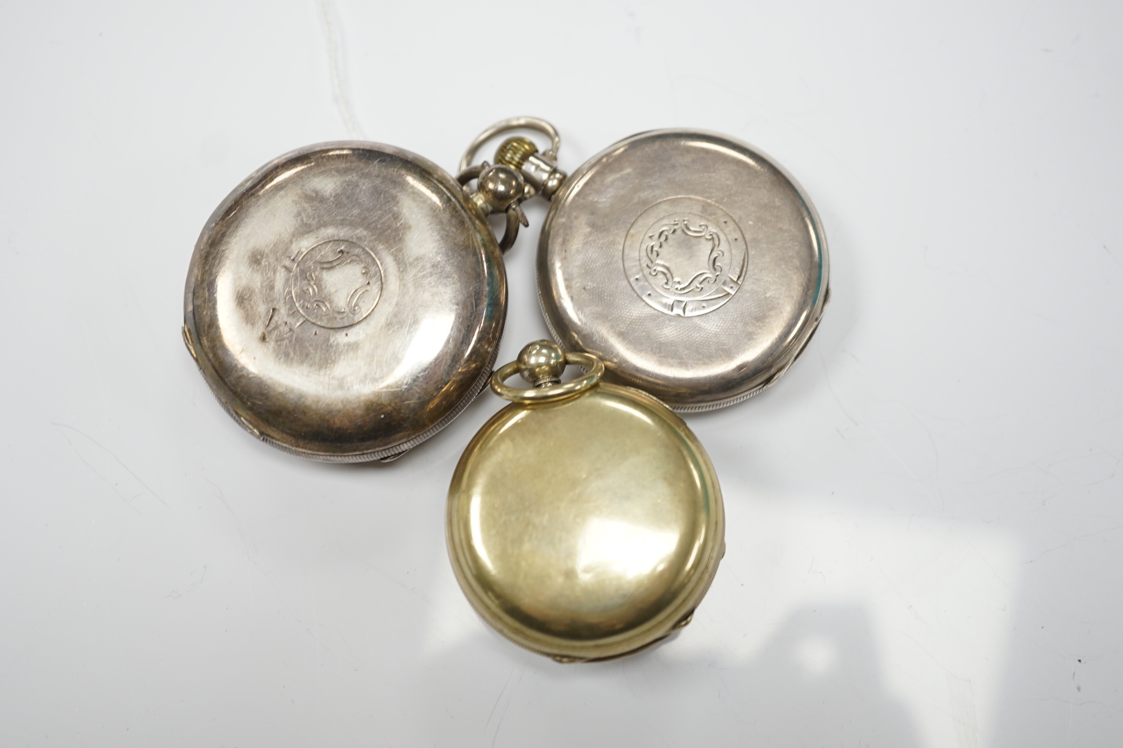 A Georgian gilt metal pair cased pocket watch (lacking outer case) by Masters of Piccadilly, with Roman dial, together with two early 20th century silver open face pocket watches including 'Express English Lever'.